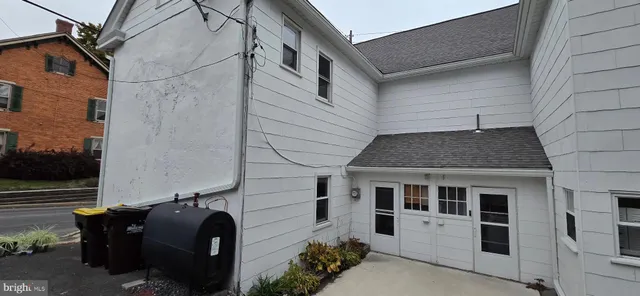 a view of a park with large trees