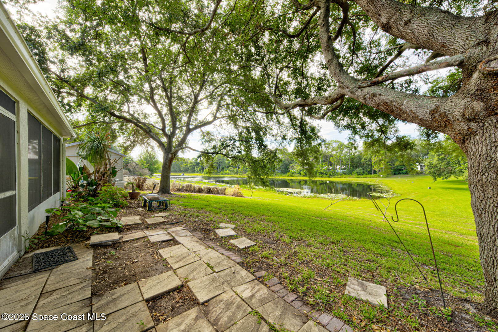 3353 Echo Ridge Place Cocoa, FL 32926 - Photo 40 of 51 backyard on lake