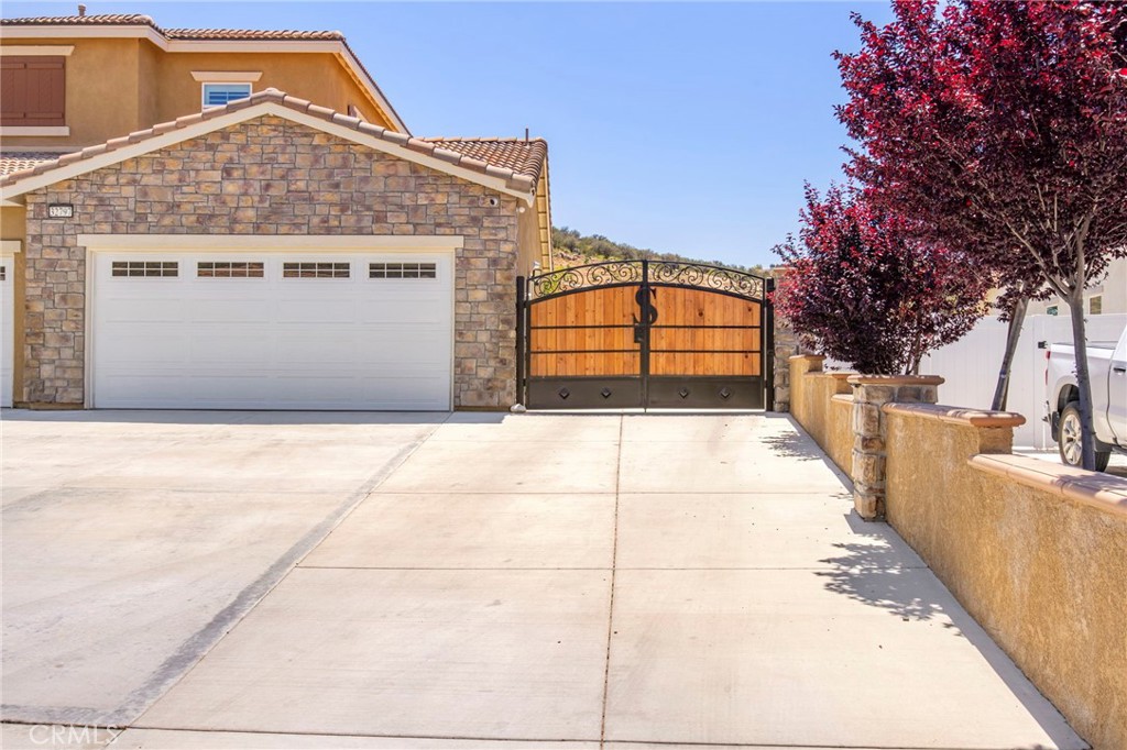 32797 Hayden Road Menifee, CA 92584 - Photo 5 of 51 a front view of a house with a garage