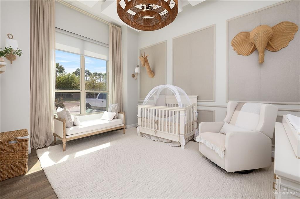 1803 Melissa Rae Drive Mission, TX 78572 - Photo 17 of 31 Bedroom with a crib and wood finished floors