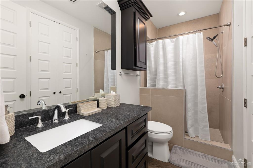 1803 Melissa Rae Drive Mission, TX 78572 - Photo 22 of 31 Full bathroom featuring vanity and a stall shower