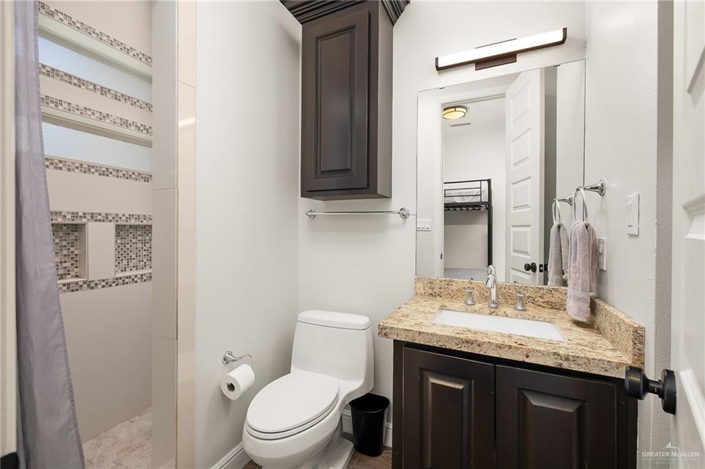 1803 Melissa Rae Drive Mission, TX 78572 - Photo 25 of 31 Bathroom with a shower stall and vanity