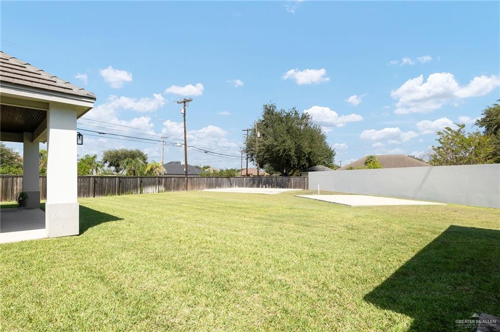1803 Melissa Rae Drive Mission, TX 78572 - Photo 29 of 31 Fenced backyard featuring a patio area