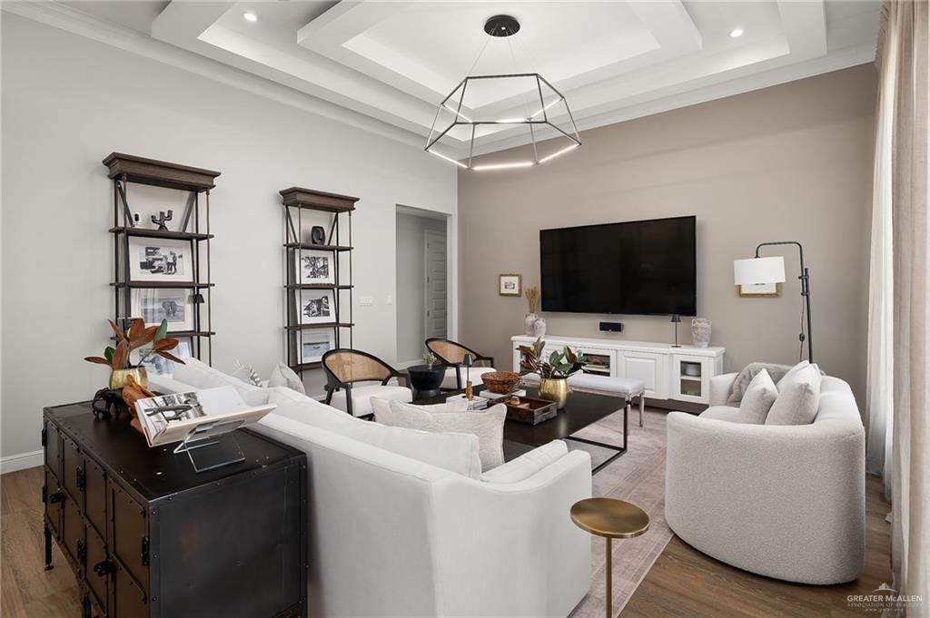 1803 Melissa Rae Drive Mission, TX 78572 - Photo 10 of 31 Living area with a tray ceiling, wood finished floors, and recessed lighting