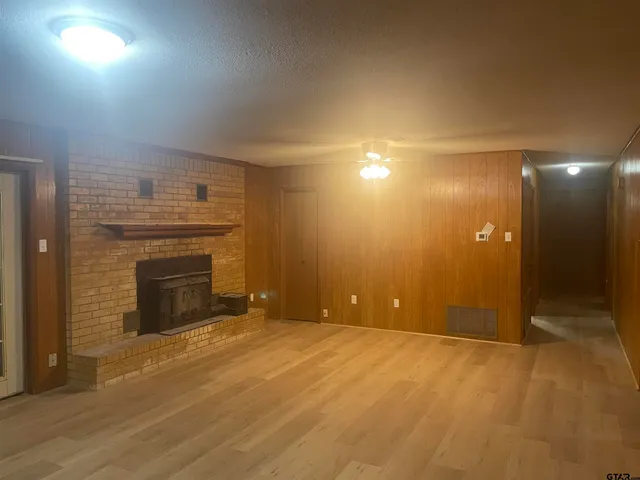 a view of a bathroom with a tub and shower