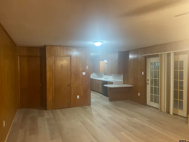 a bathroom with a shower and a mirror