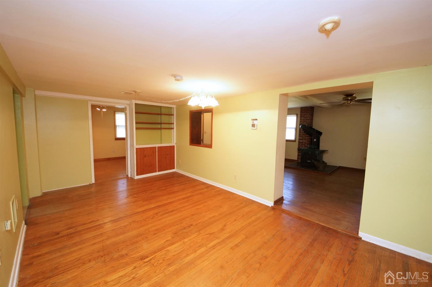 301 Friendship Road Cranbury, NJ 08512 - Photo 14 of 47 a view of a livingroom with wooden floor and a refrigerator