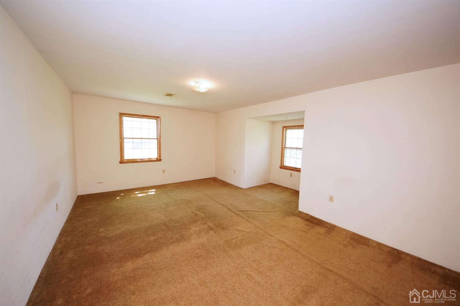 301 Friendship Road Cranbury, NJ 08512 - Photo 22 of 47 an empty room with windows