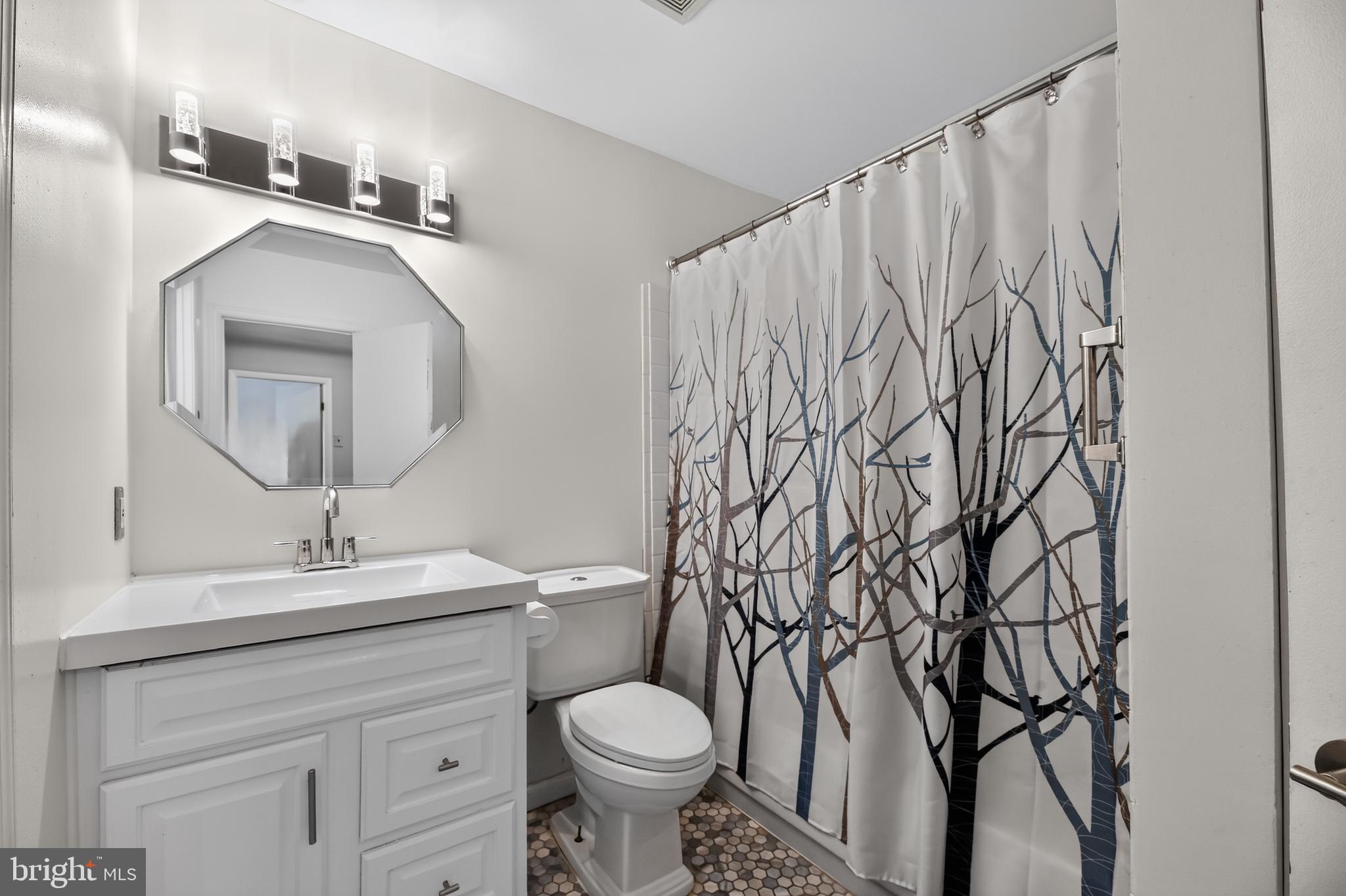 1802 Winding Way Clementon, NJ 08021 - Photo 18 of 30 a bathroom with a toilet sink and mirror