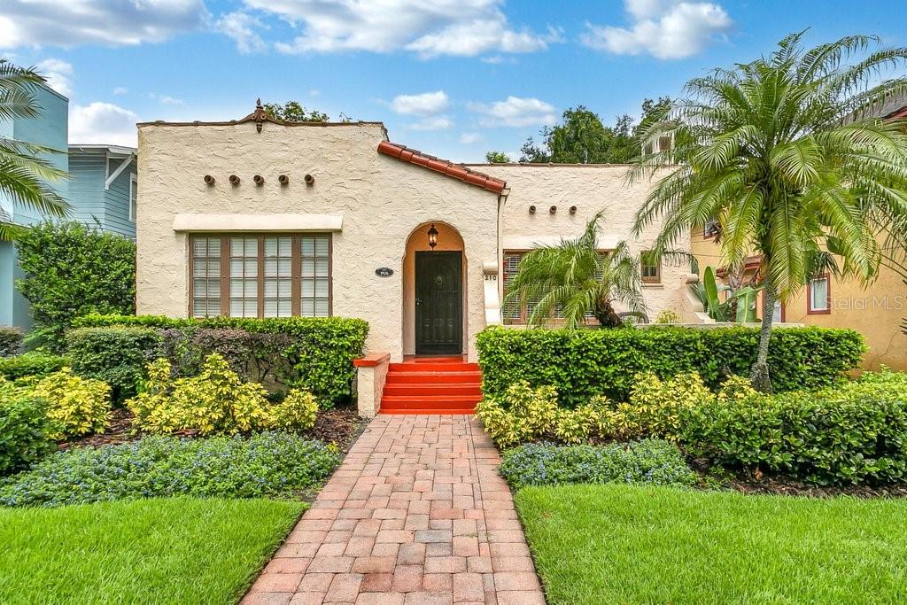 210 South Thornton Avenue Orlando, FL 32801 - Photo 1 of 1 a front view of a house with a garden