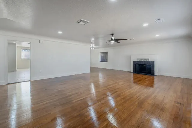 a view of a livingroom with wooden floor