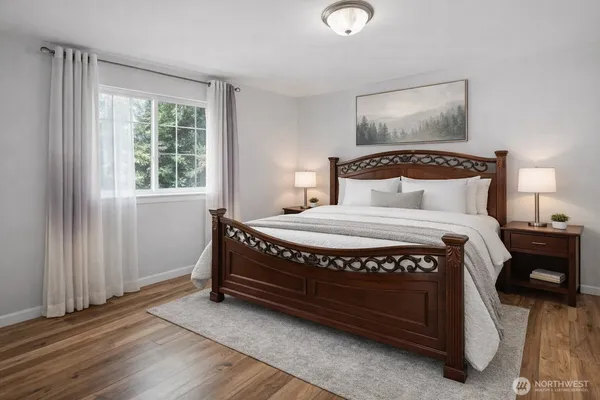 a bedroom with a bed and window