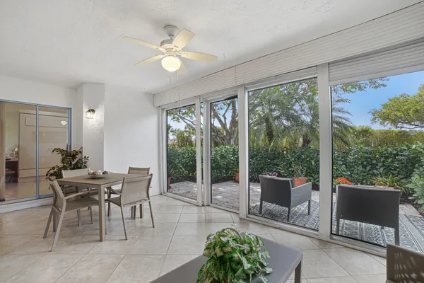 a view of a dining room with furniture window and outside view