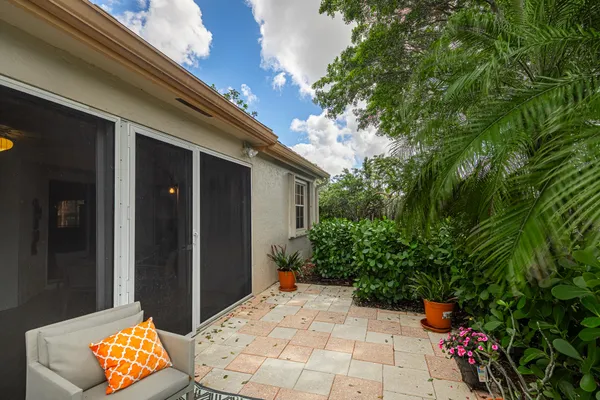 a backyard of a house with outdoor seating
