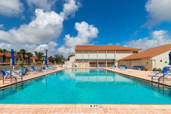 a view of a swimming pool with a garden