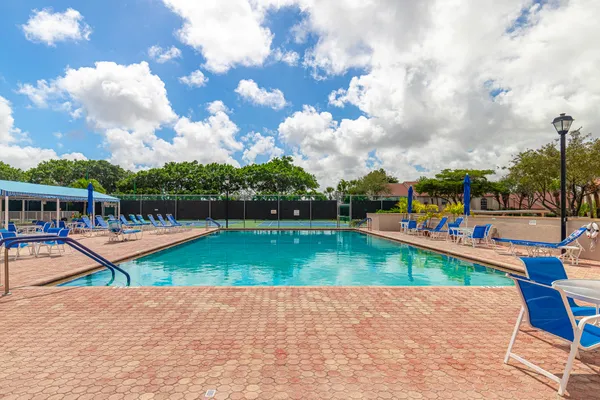 a view of a swimming pool with a patio