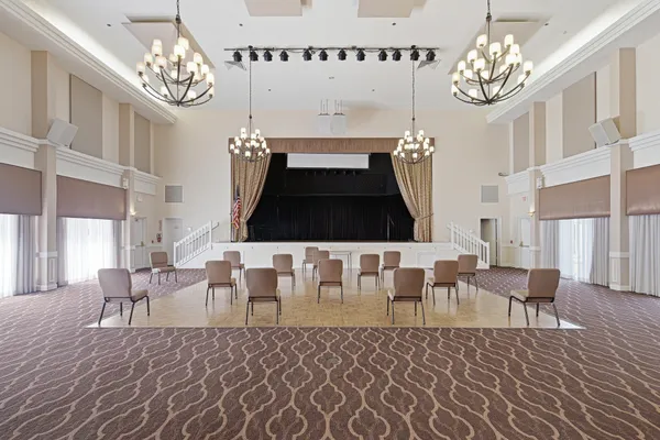 a living room with furniture chandelier and a chandelier