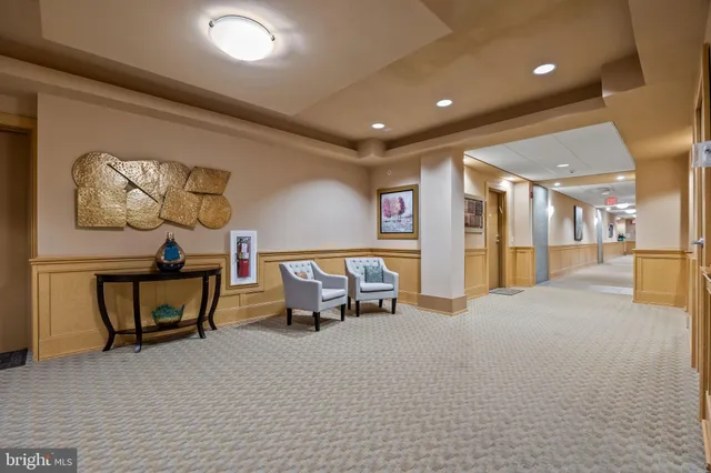 a lobby with furniture and window