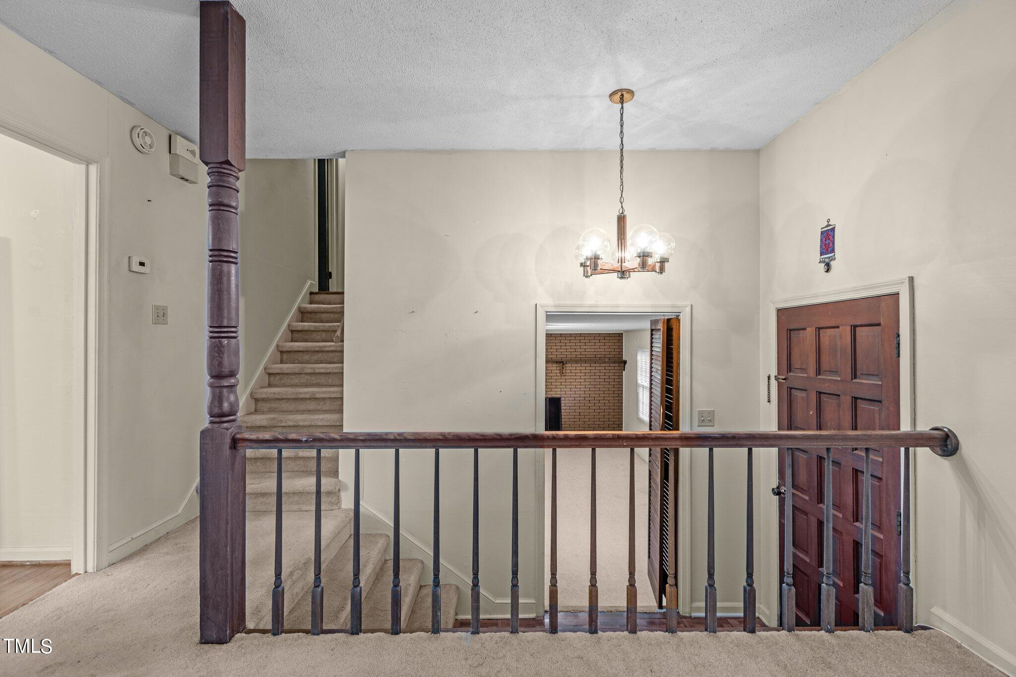 1500 Princess Anne Road Raleigh, NC 27607 - Photo 4 of 37 a view of a hallway with windows