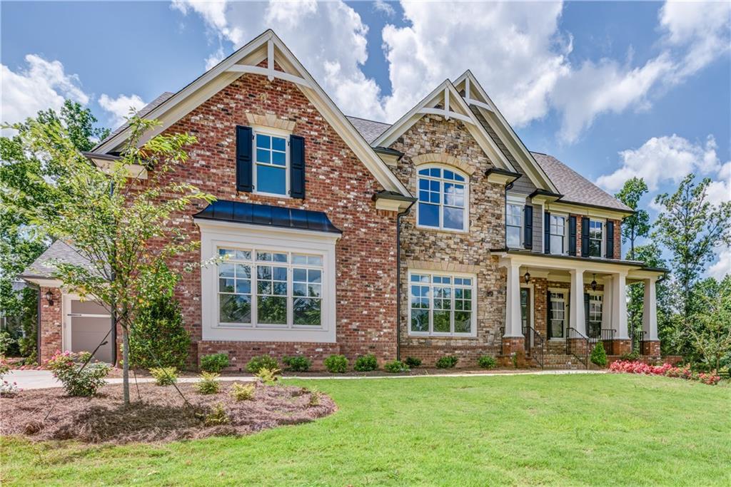 12725 Ruth's Farm Way Alpharetta, GA 30004 - Photo 1 of 1 front view of a house with a yard