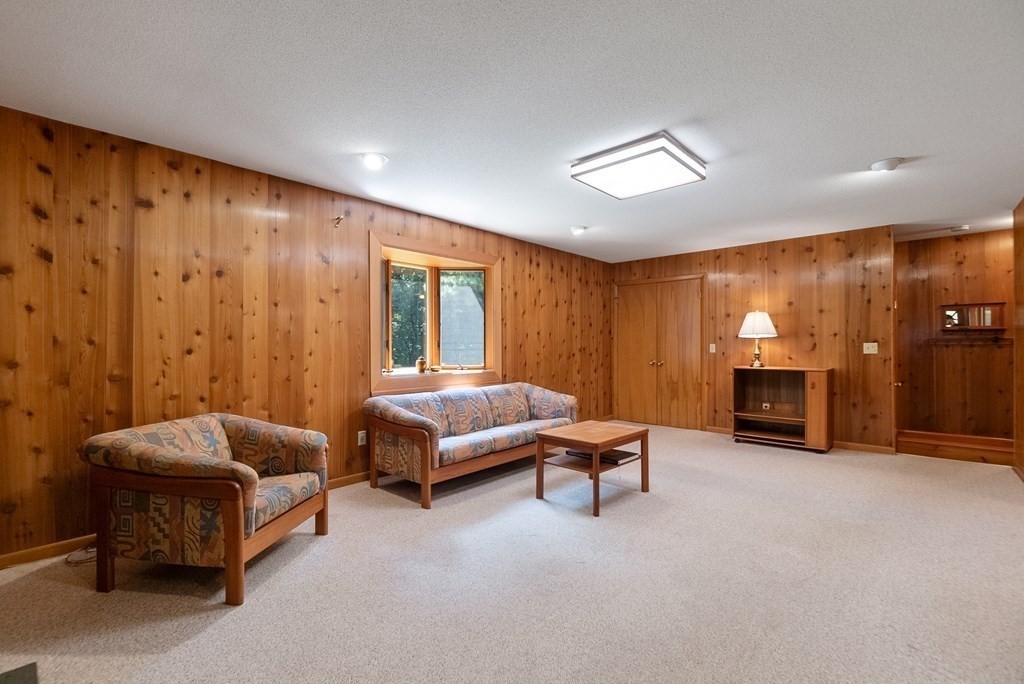 83 Redfern Drive Longmeadow, MA 01106 - Photo 13 of 40 a spacious bedroom with a bed and a fireplace