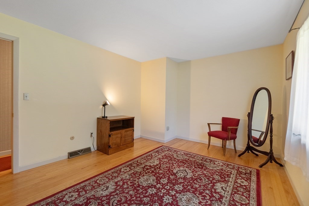 83 Redfern Drive Longmeadow, MA 01106 - Photo 20 of 40 a bedroom with a bed and a chair