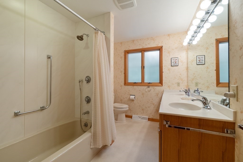 83 Redfern Drive Longmeadow, MA 01106 - Photo 23 of 40 a bathroom with a sink a toilet and shower