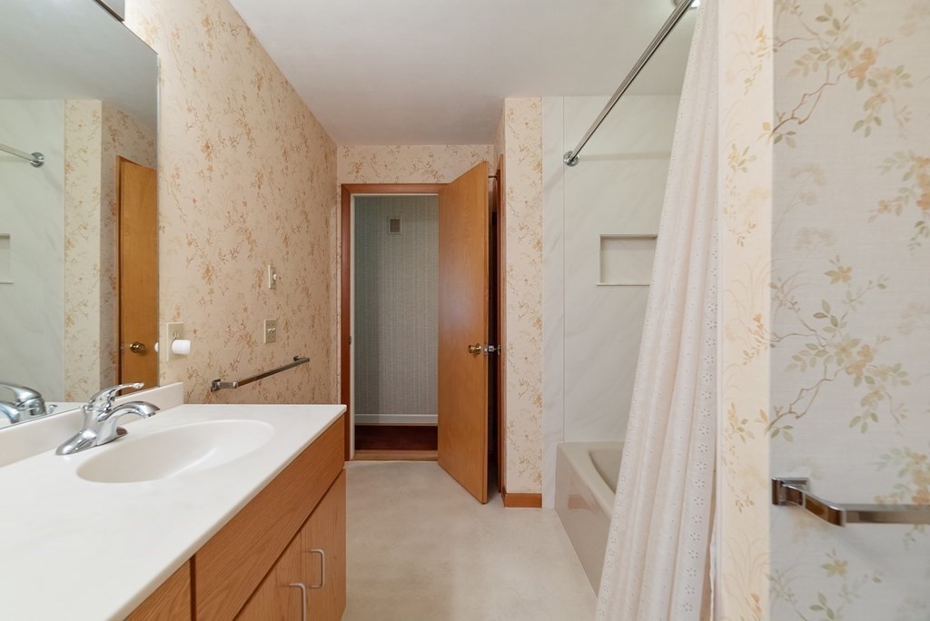 83 Redfern Drive Longmeadow, MA 01106 - Photo 24 of 40 a bathroom with a sink and a mirror