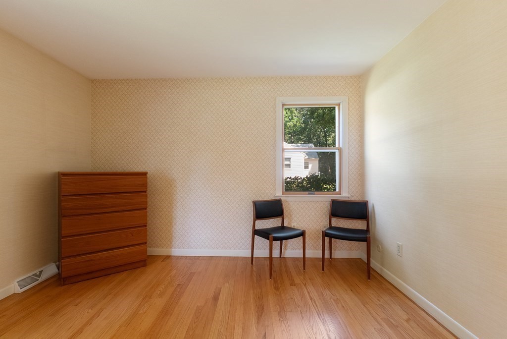 83 Redfern Drive Longmeadow, MA 01106 - Photo 26 of 40 a room with a chair and a window