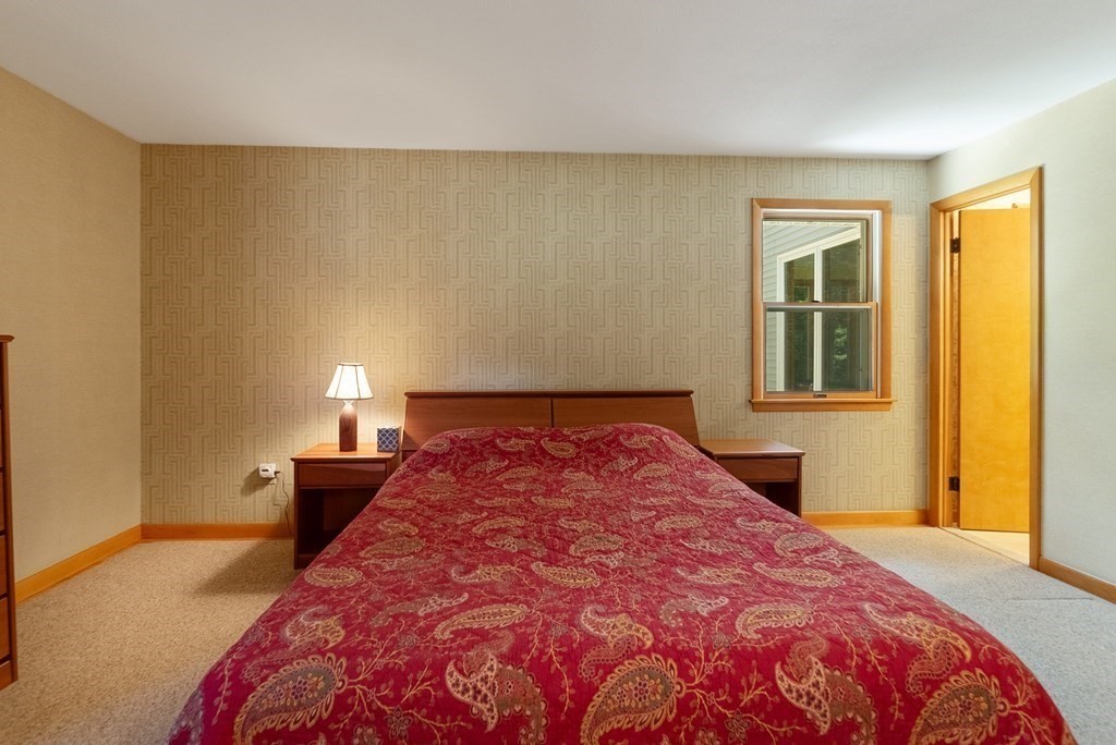 83 Redfern Drive Longmeadow, MA 01106 - Photo 30 of 40 a bedroom with a bed and wooden floor