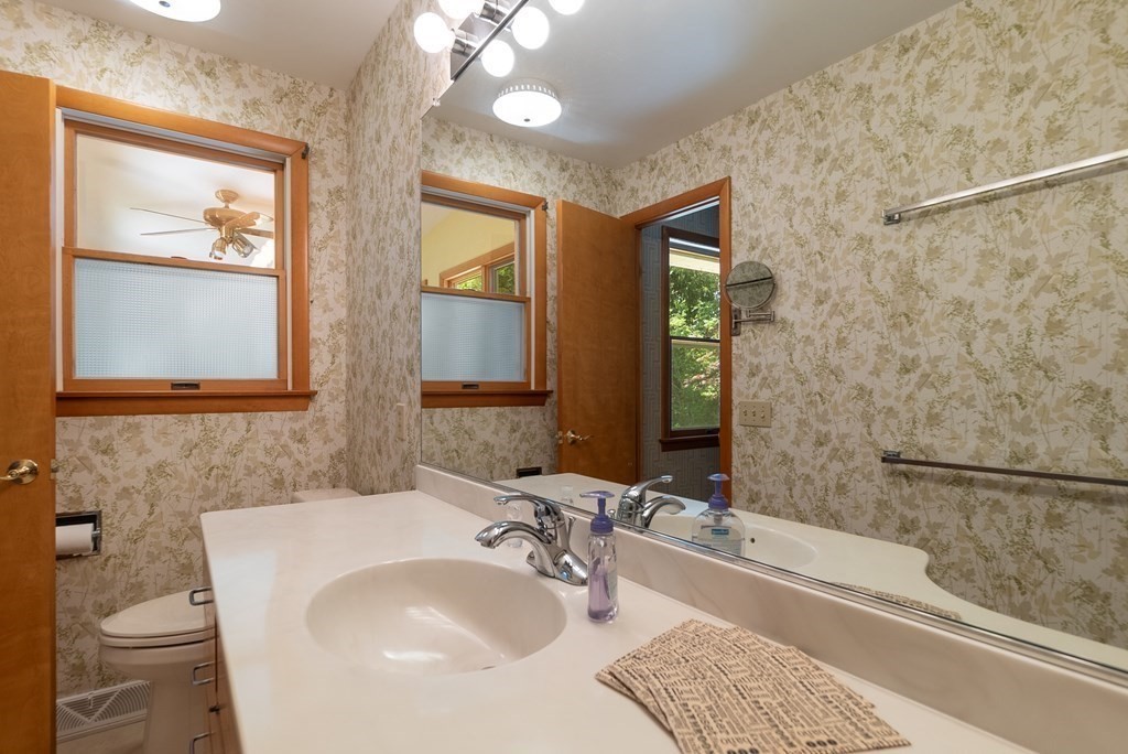 83 Redfern Drive Longmeadow, MA 01106 - Photo 34 of 40 a bathroom with a tub sink and mirror