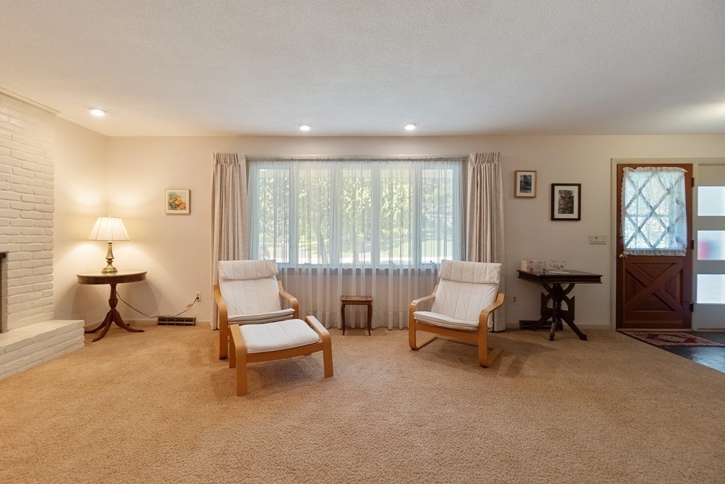 83 Redfern Drive Longmeadow, MA 01106 - Photo 6 of 40 a living room with furniture and a lamp