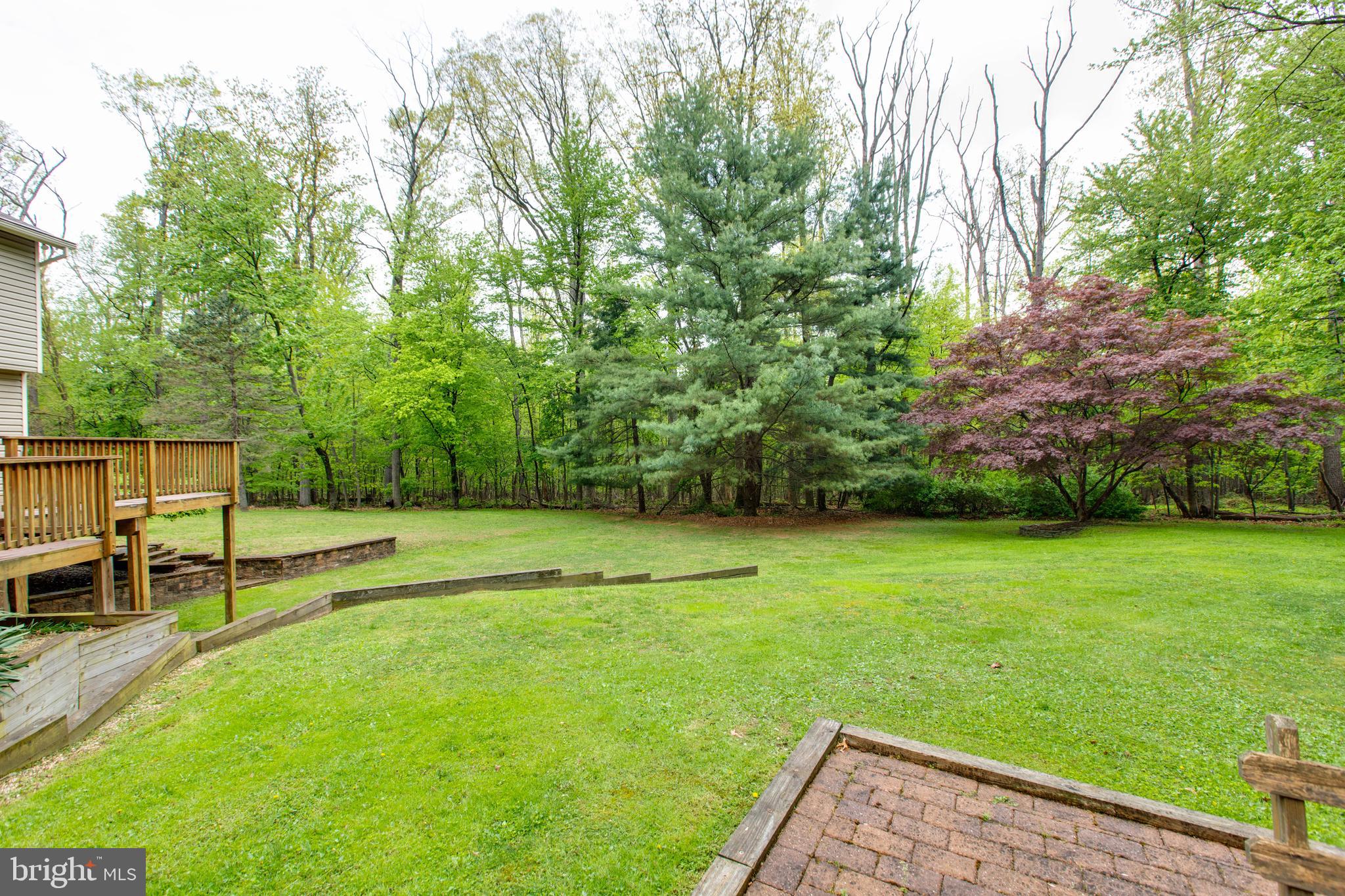 5519 Woodbine Road Sykesville, MD 21784 - Photo 52 of 69 a view of a backyard with a garden