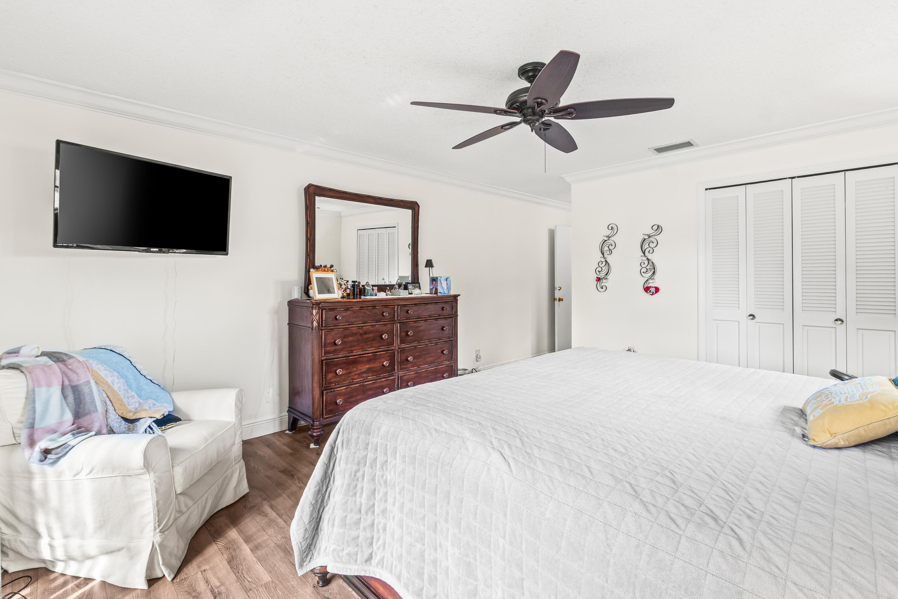 4863 Hawkwood Road, Unit B Boynton Beach, FL 33436 - Photo 13 of 23 a bedroom with a bed and a television