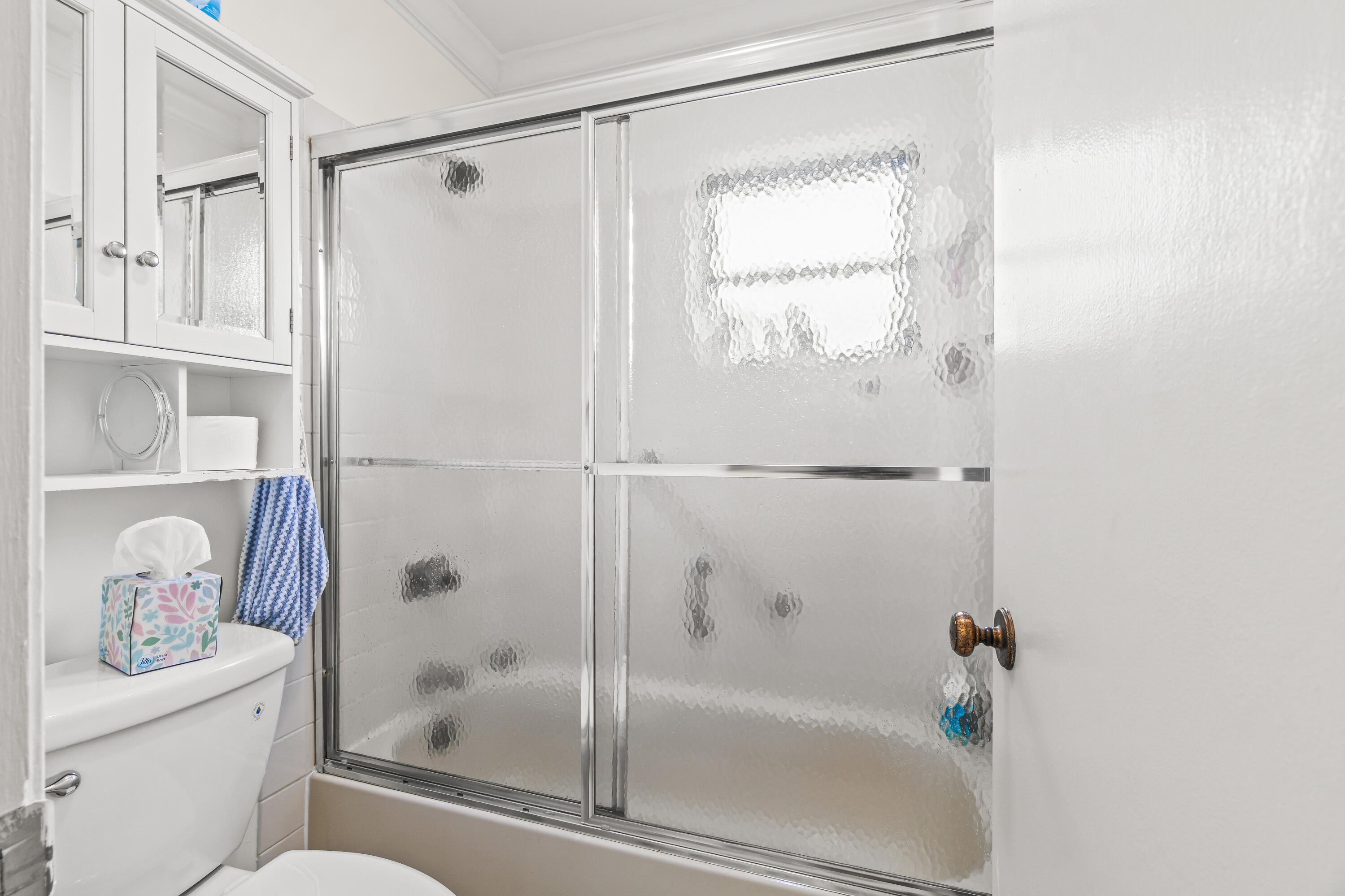 4863 Hawkwood Road, Unit B Boynton Beach, FL 33436 - Photo 15 of 23 a bathroom with a bathtub and a shower