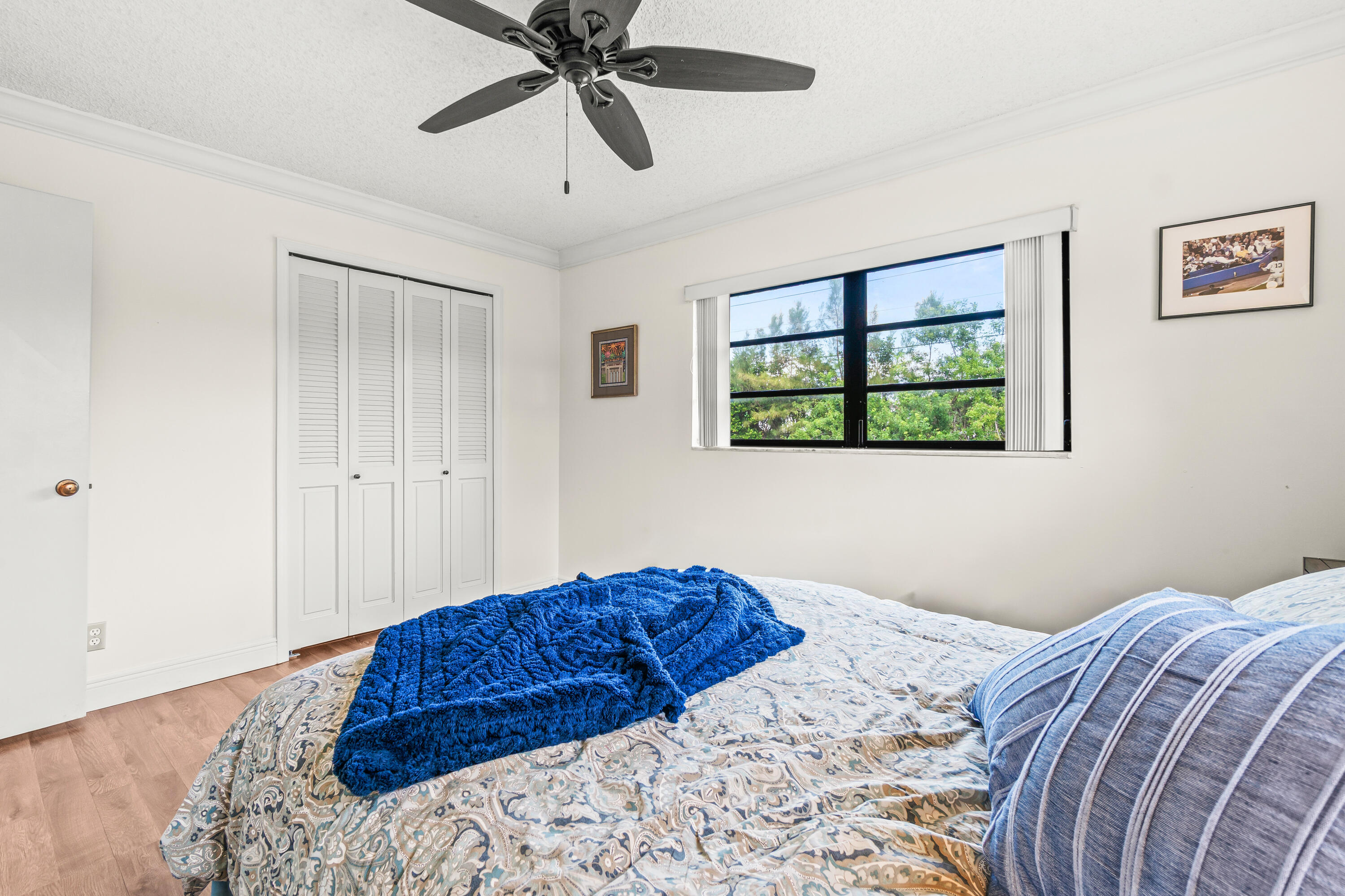 4863 Hawkwood Road, Unit B Boynton Beach, FL 33436 - Photo 16 of 23 a bedroom with a large bed and a window