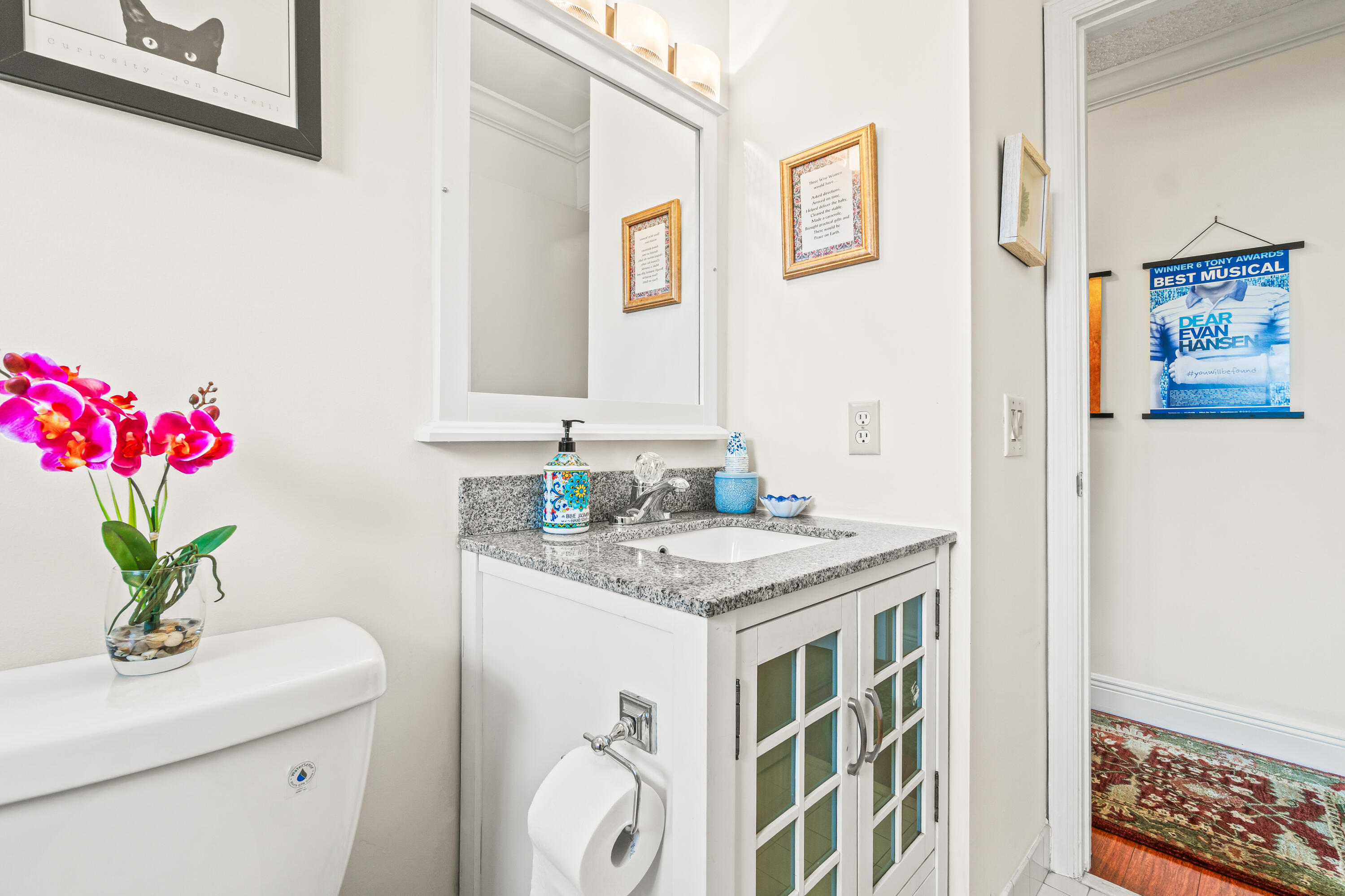 4863 Hawkwood Road, Unit B Boynton Beach, FL 33436 - Photo 18 of 23 a bath room with a sink and a mirror