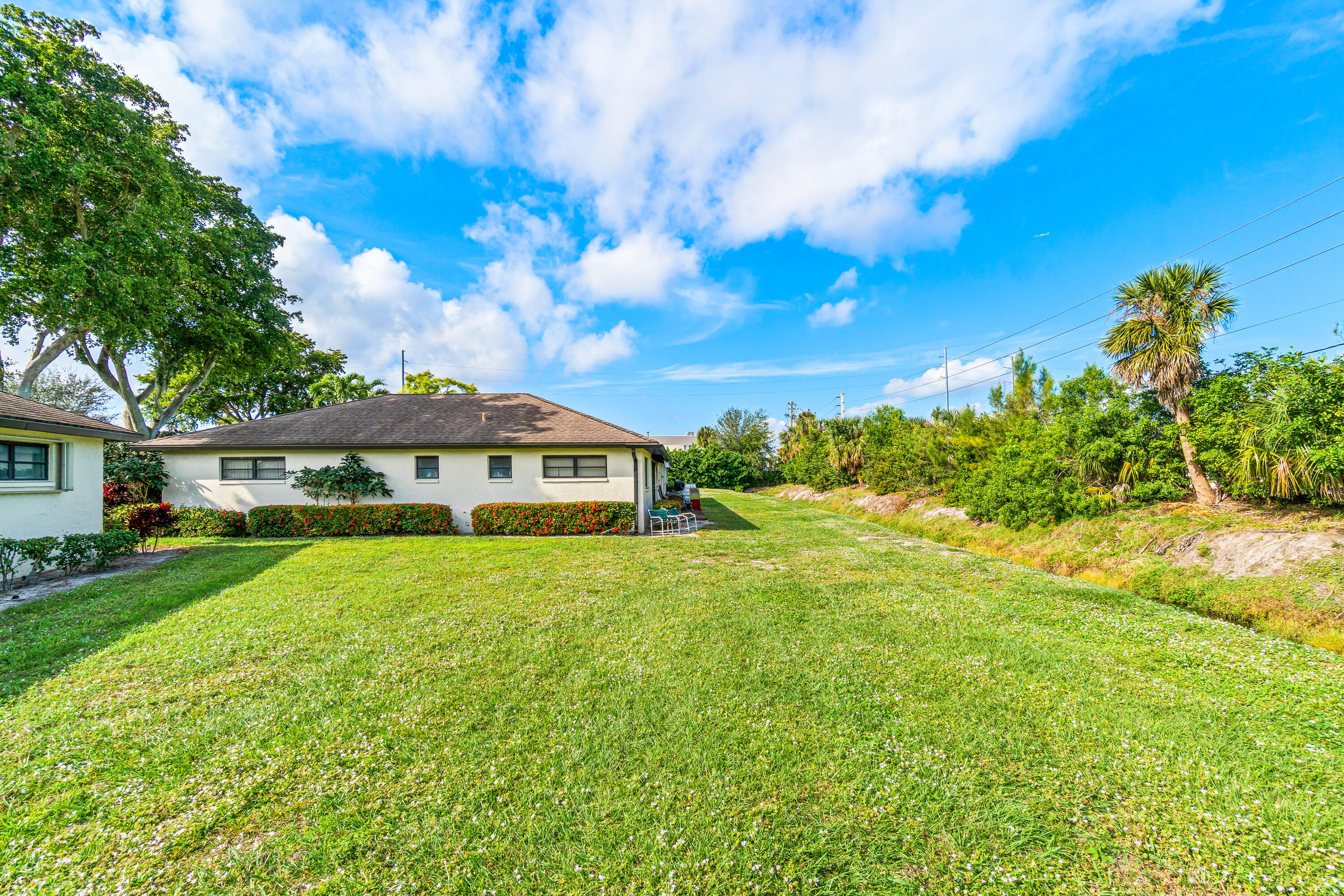 4863 Hawkwood Road, Unit B Boynton Beach, FL 33436 - Photo 23 of 23 a view of a house with a big yard