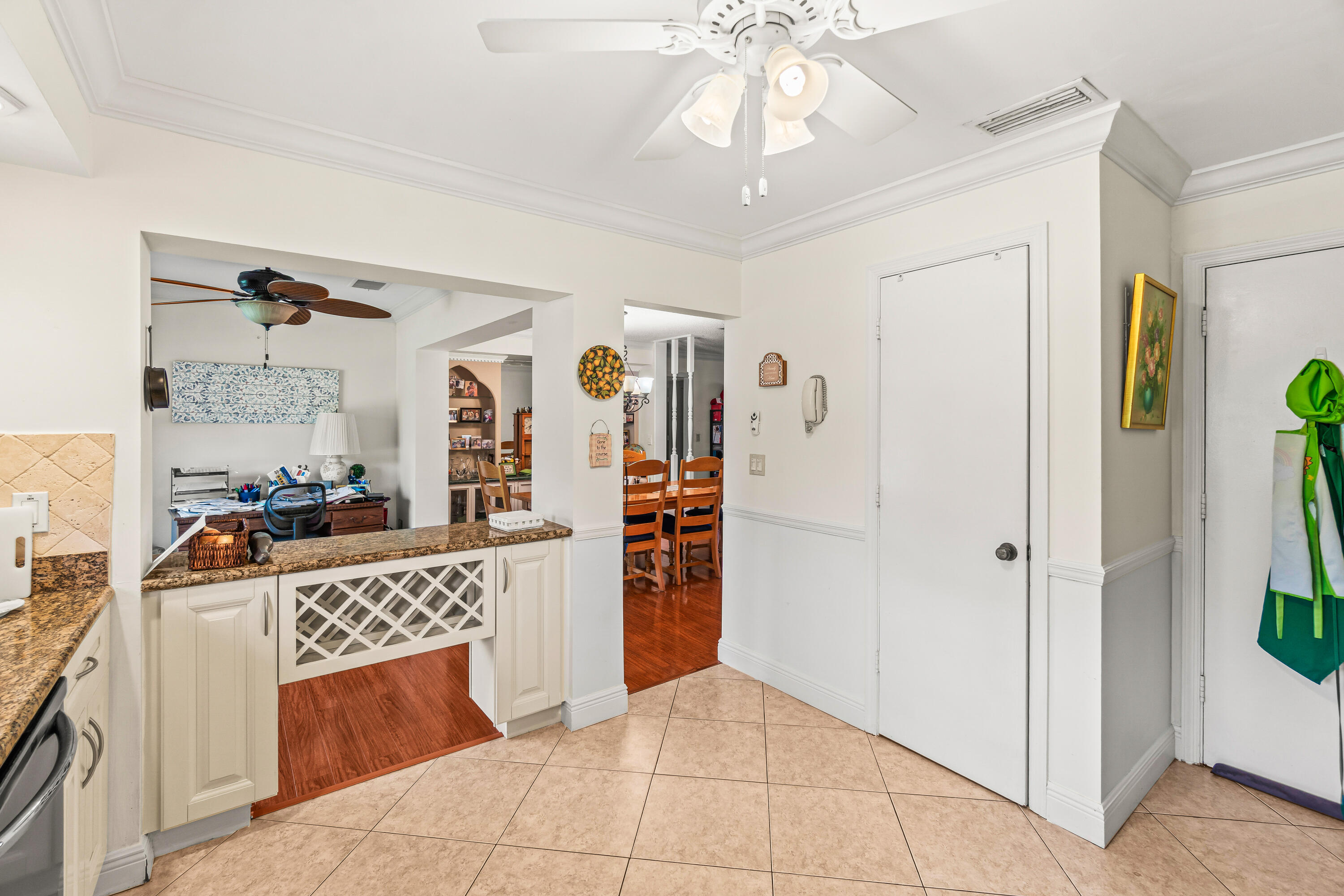4863 Hawkwood Road, Unit B Boynton Beach, FL 33436 - Photo 5 of 23 a view of a kitchen with a sink and cabinet area