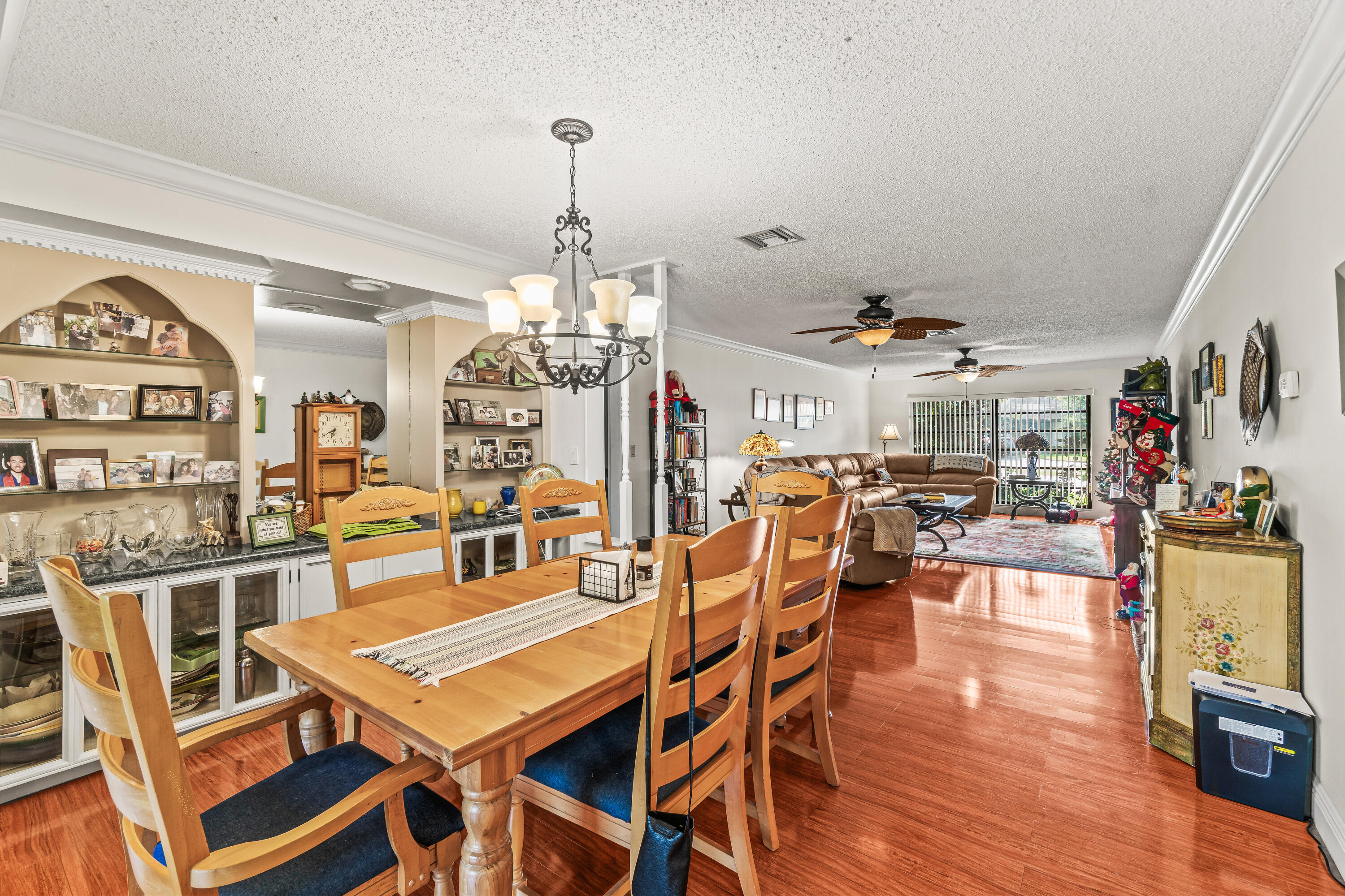 4863 Hawkwood Road, Unit B Boynton Beach, FL 33436 - Photo 8 of 23 a dining room with lots of furniture and wooden floor