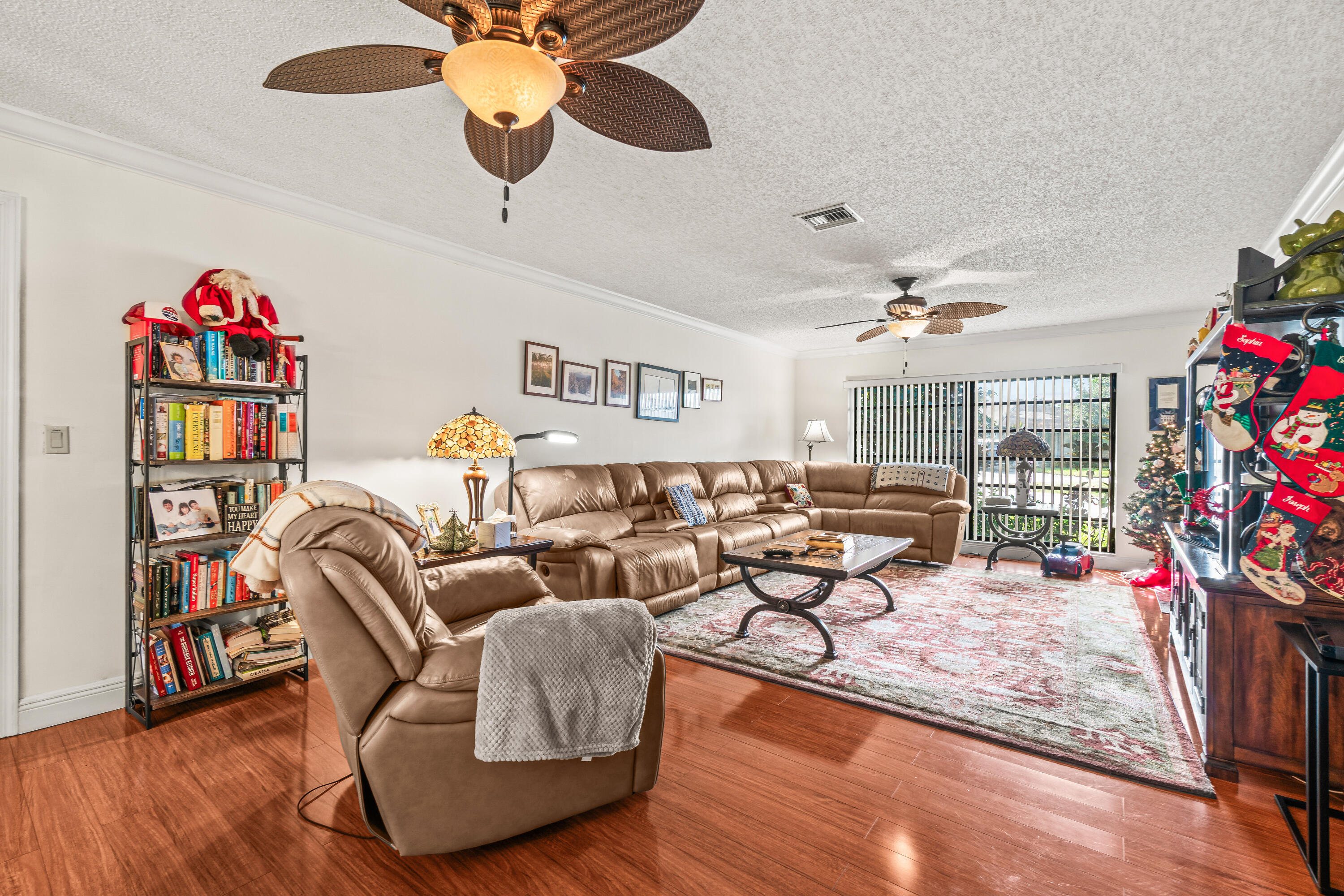 4863 Hawkwood Road, Unit B Boynton Beach, FL 33436 - Photo 9 of 23 a living room with furniture and a flat screen tv
