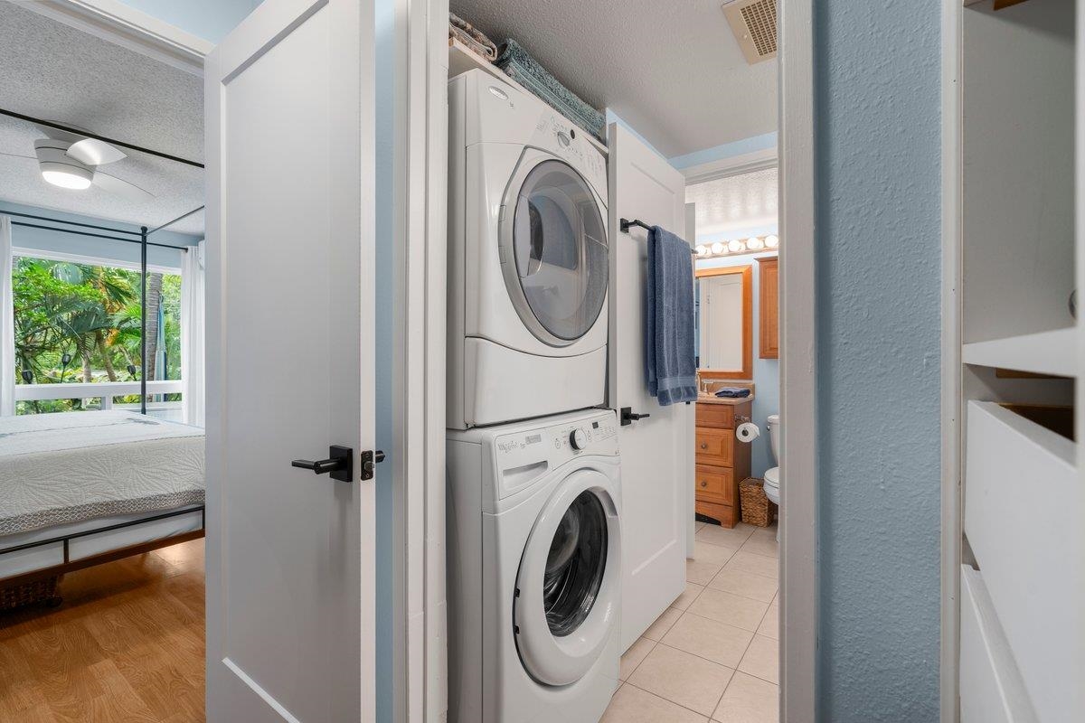 140 Uwapo Road, Unit 35102 Kihei, HI 96753 - Photo 16 of 30 a utility room with dryer and washer