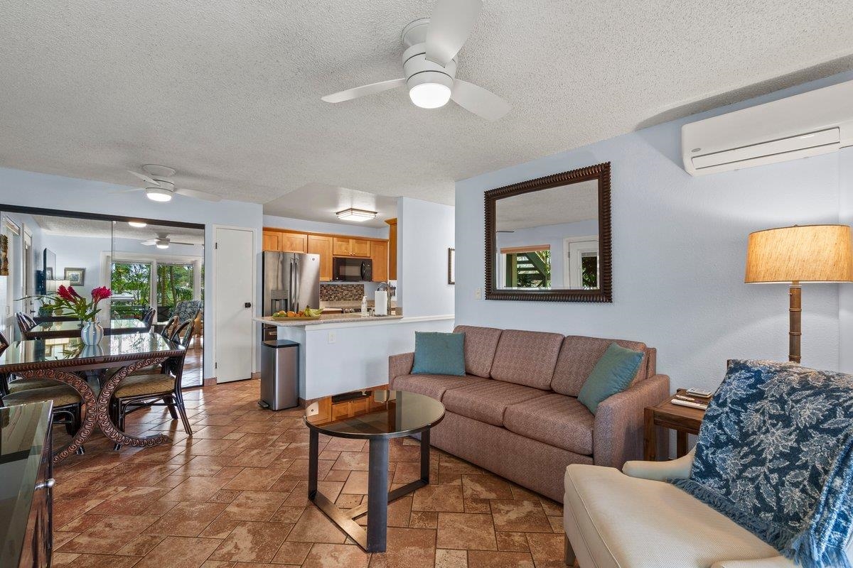 140 Uwapo Road, Unit 35102 Kihei, HI 96753 - Photo 24 of 30 a living room with furniture and a flat screen tv