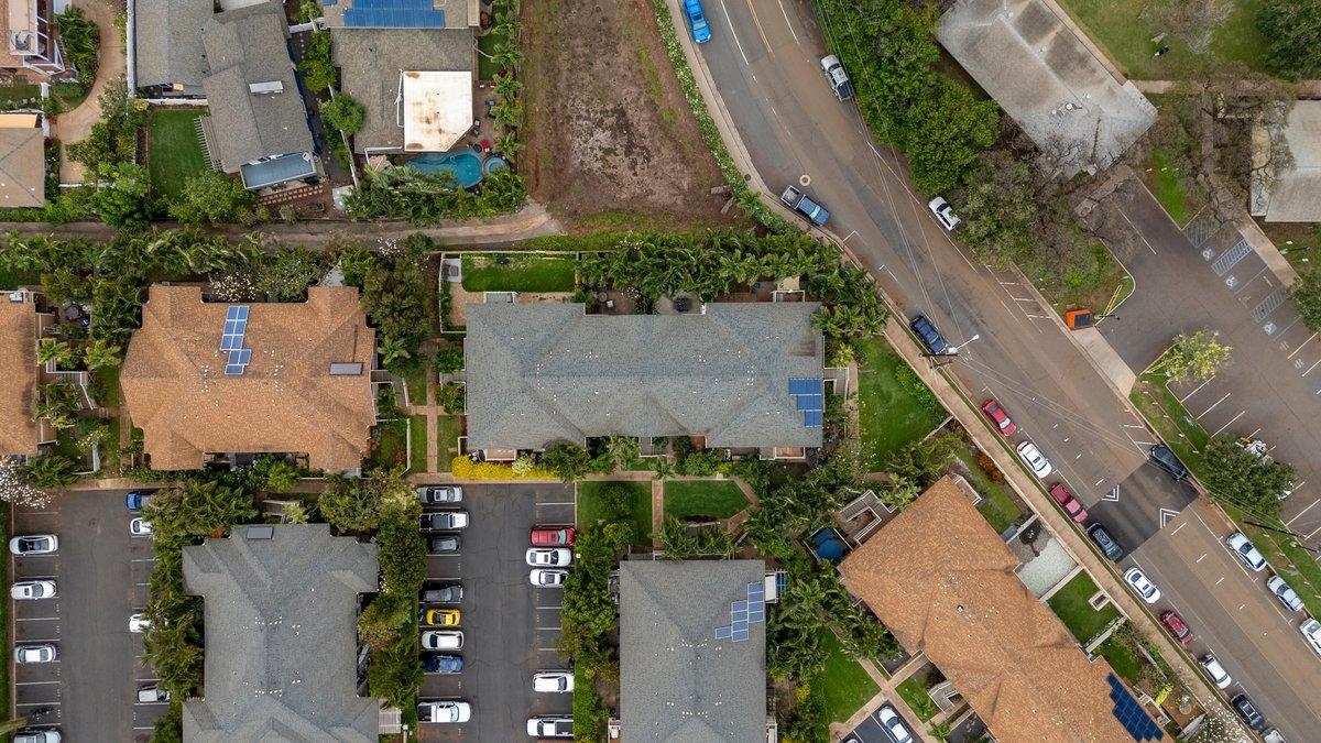 140 Uwapo Road, Unit 35102 Kihei, HI 96753 - Photo 30 of 30 an aerial view of residential houses with outdoor space