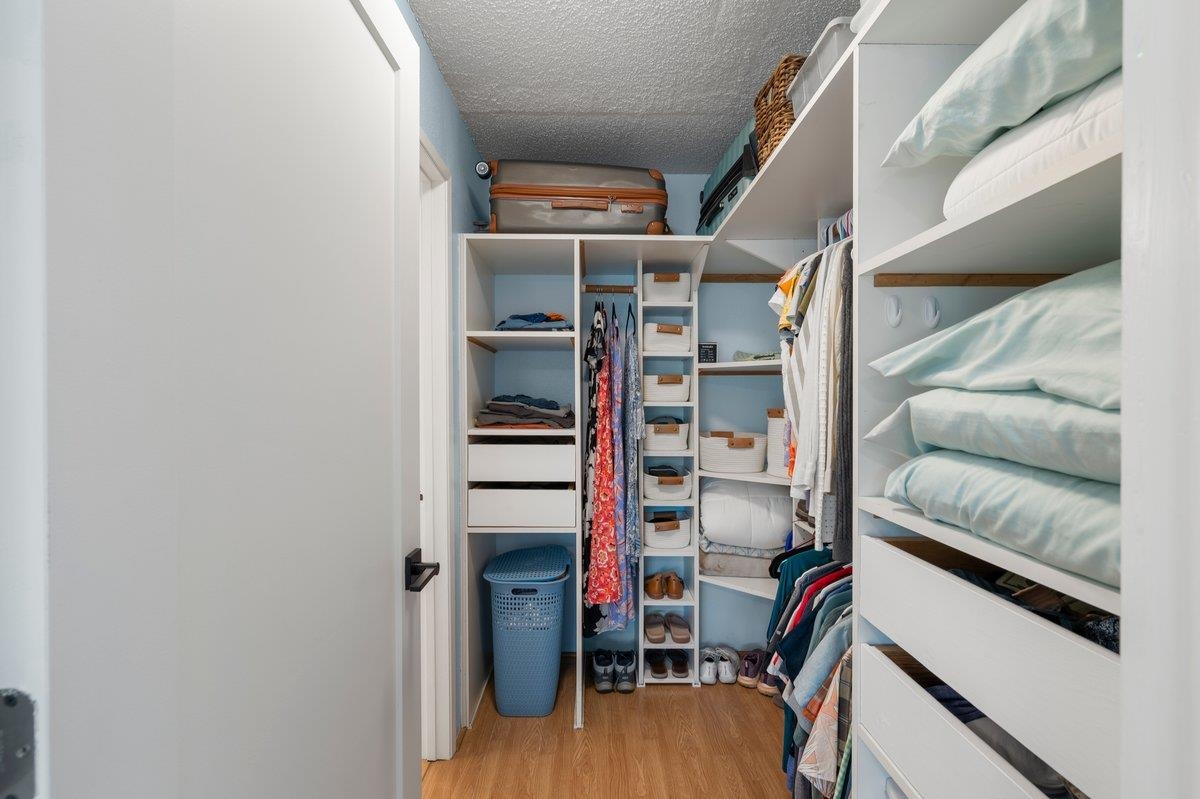 140 Uwapo Road, Unit 35102 Kihei, HI 96753 - Photo 10 of 30 a view of walk in closet with clothes and shoes