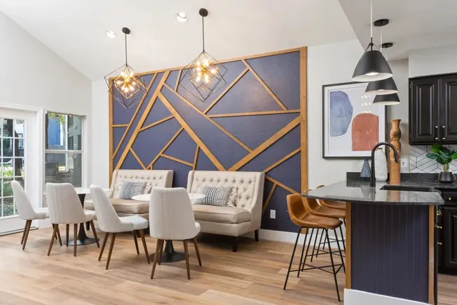 a dining room with furniture and window
