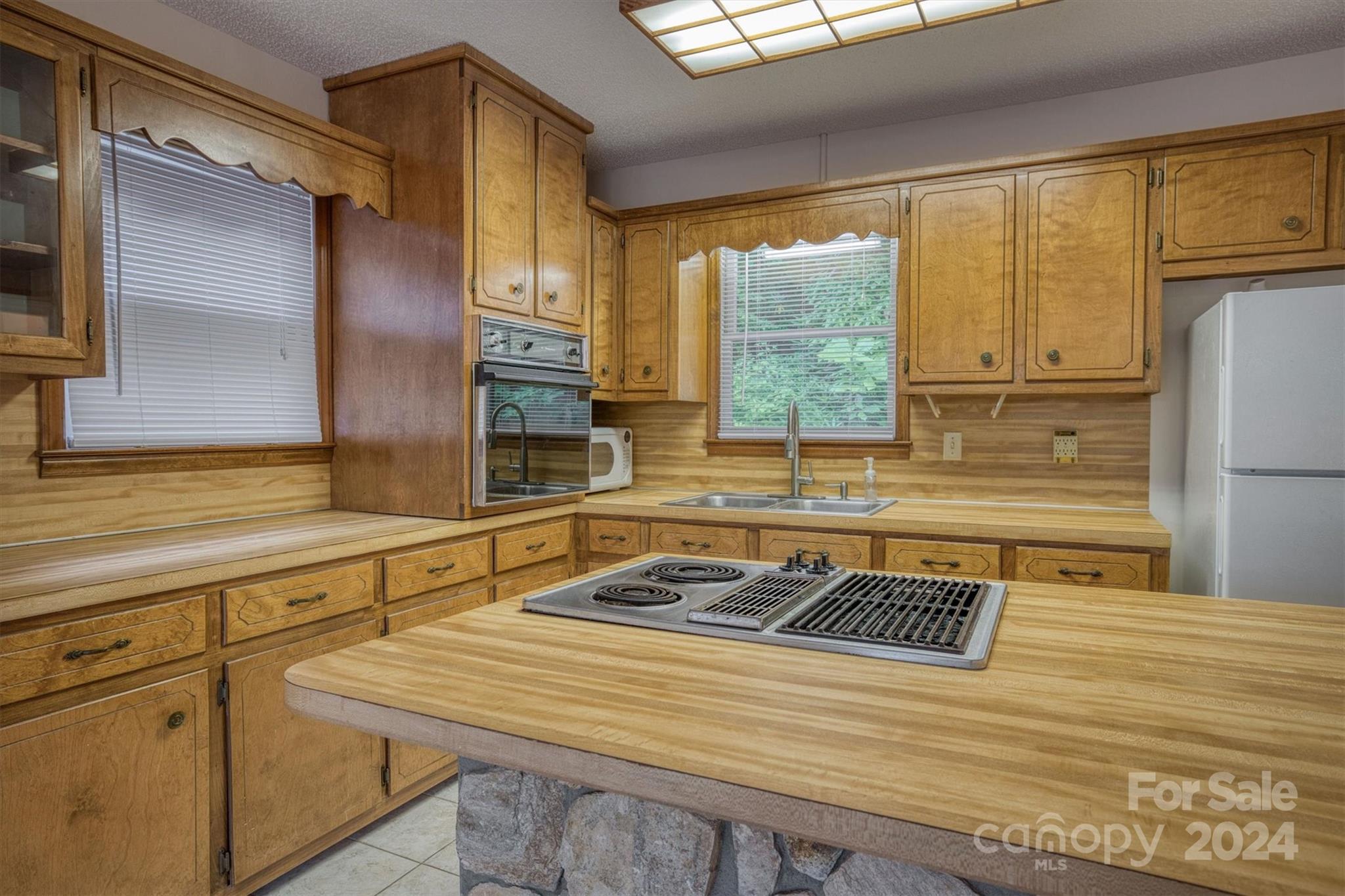 455 Hemlock Hill Road Boone, NC 28607 - Photo 25 of 37 a bathroom with a sink and a large mirror