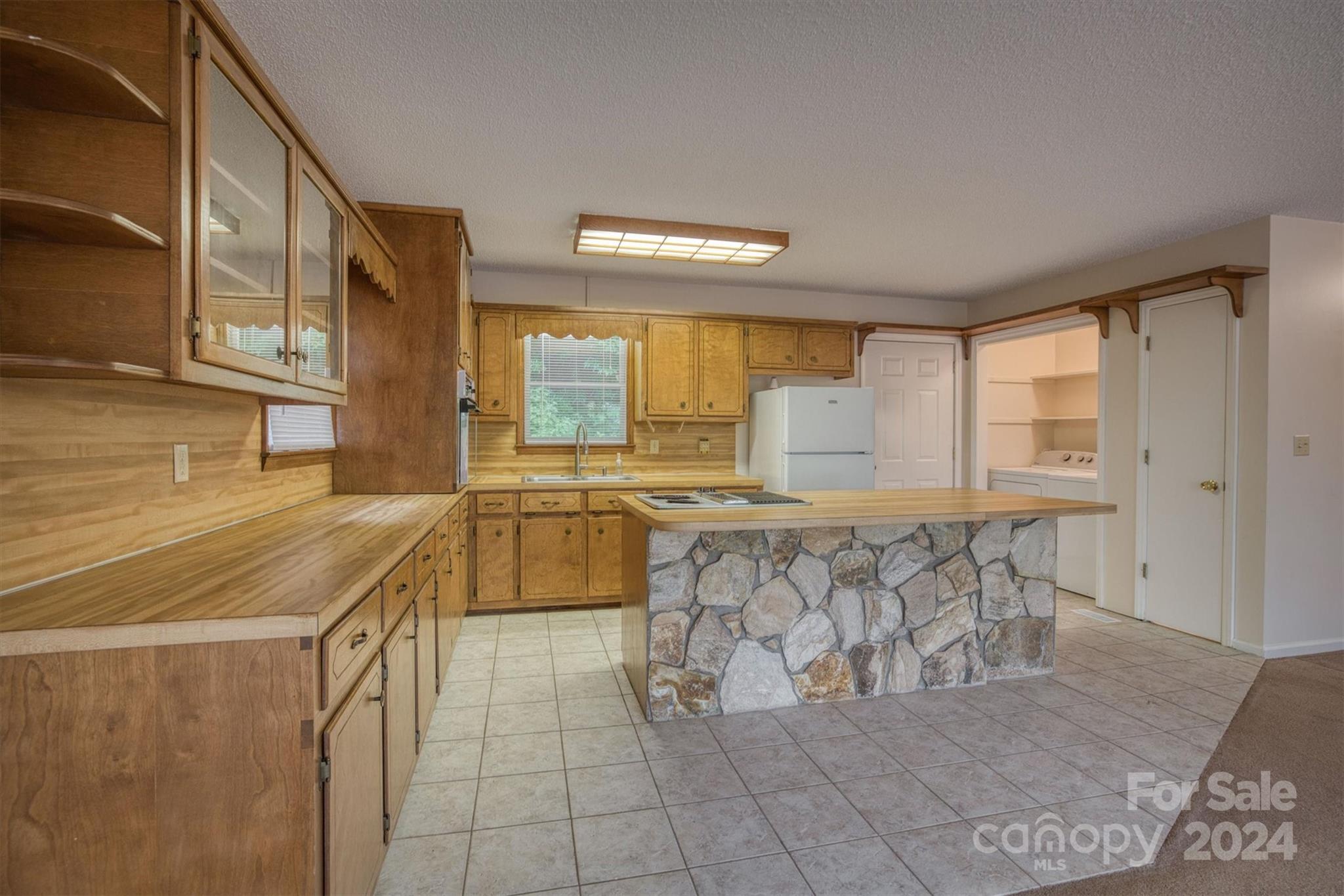 455 Hemlock Hill Road Boone, NC 28607 - Photo 26 of 37 a kitchen with stainless steel appliances granite countertop a sink and cabinets