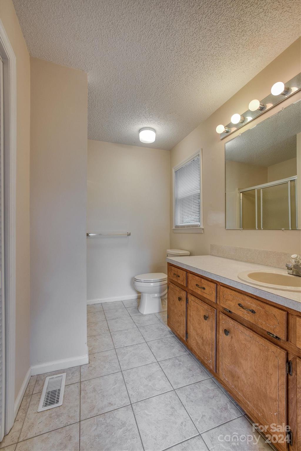 455 Hemlock Hill Road Boone, NC 28607 - Photo 33 of 37 a bathroom with a sink a toilet and a mirror