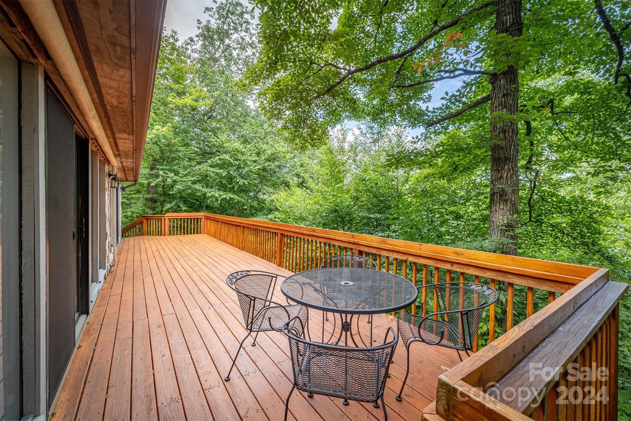 455 Hemlock Hill Road Boone, NC 28607 - Photo 7 of 37 a view of balcony with wooden floor and outdoor seating